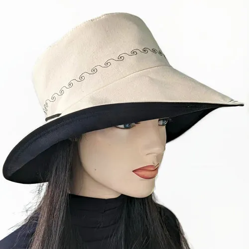 100-a Extra large bucket brim Sunblocker in neutral color with black trim, adjustable fit