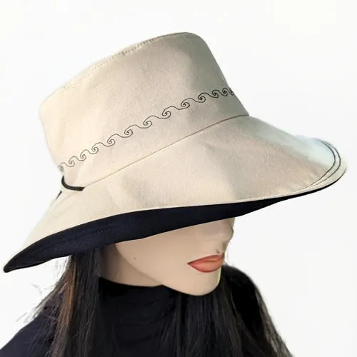 100-a Extra large bucket brim Sunblocker in neutral color with black trim, adjustable fit