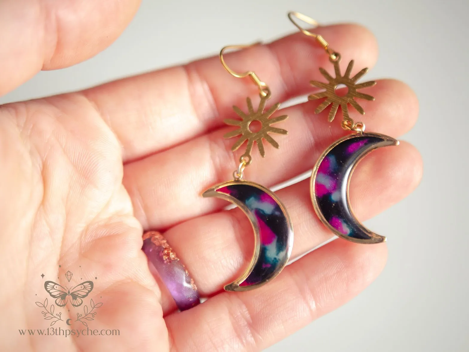 Spotted black dangle crescent moon earrings